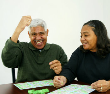 elderly man and caregiver playing